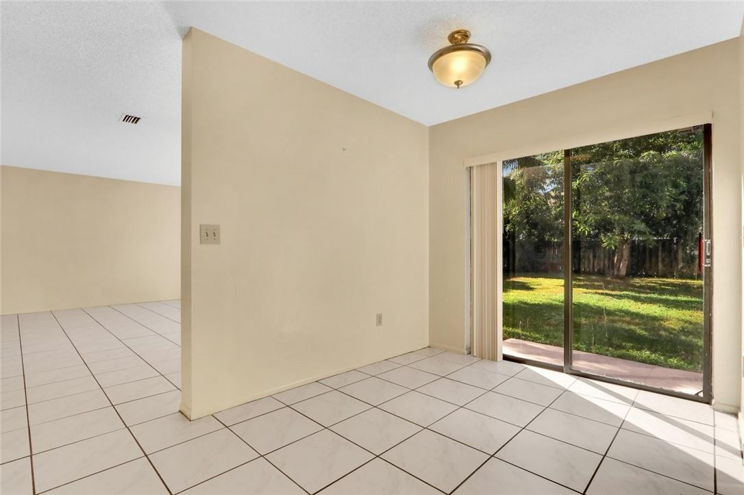 22933 Old Inlet Bridge Drive Boca Raton, FL 33433 - Photo 13 of 26 a view of a room with a large window and an outdoor space