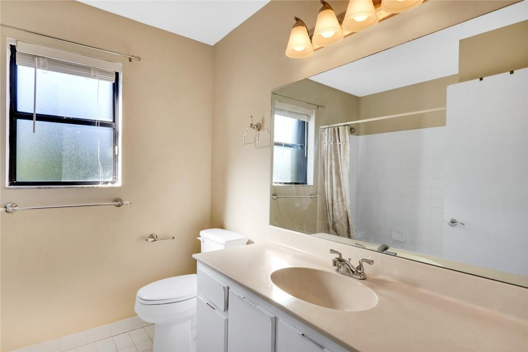 22933 Old Inlet Bridge Drive Boca Raton, FL 33433 - Photo 26 of 26 a bathroom with a sink toilet and mirror