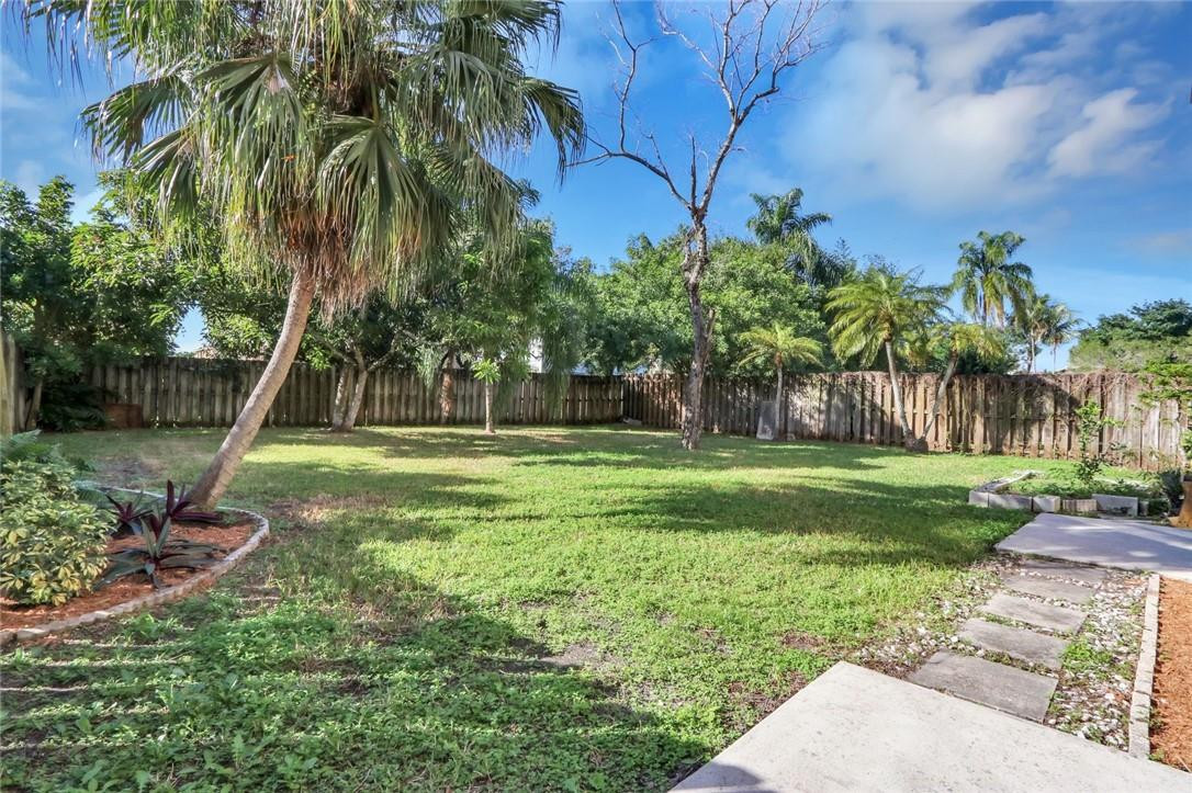 22933 Old Inlet Bridge Drive Boca Raton, FL 33433 - Photo 4 of 26 a view of a yard with a palm tree
