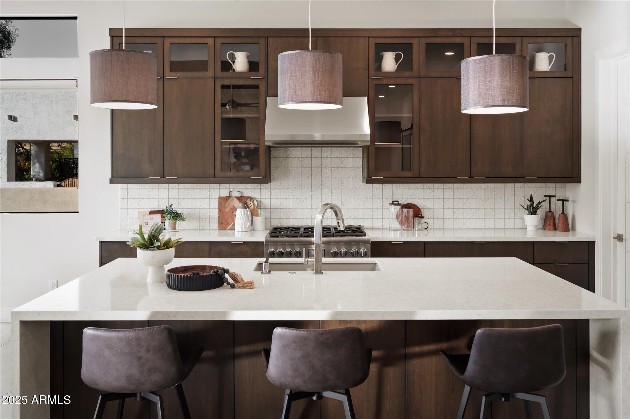 19108 East Tonto Verde Drive Rio Verde, AZ 85263 - Photo 10 of 46 a kitchen with stainless steel appliances a sink and a table
