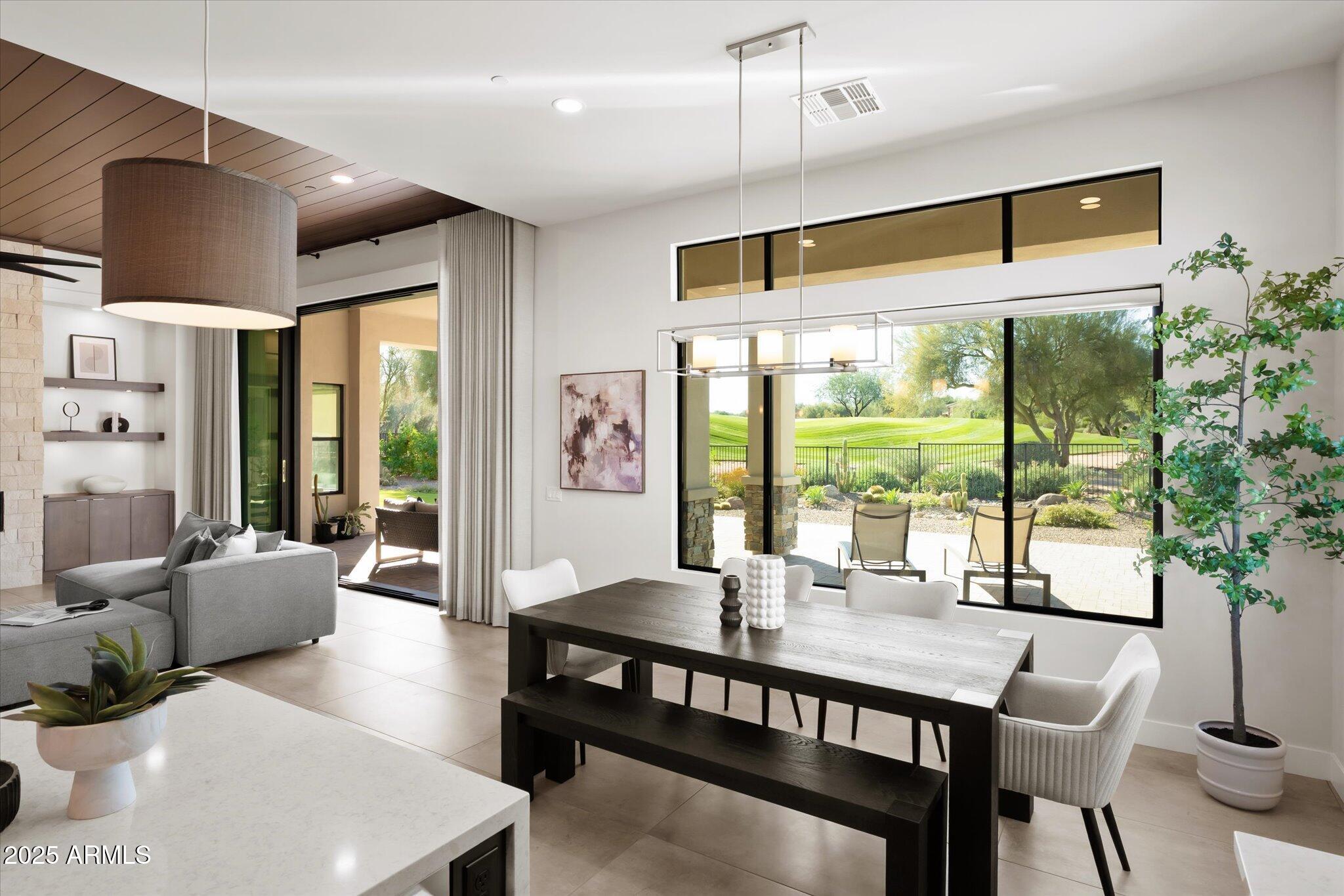 19108 East Tonto Verde Drive Rio Verde, AZ 85263 - Photo 14 of 46 a dining room with furniture a chandelier and wooden floor