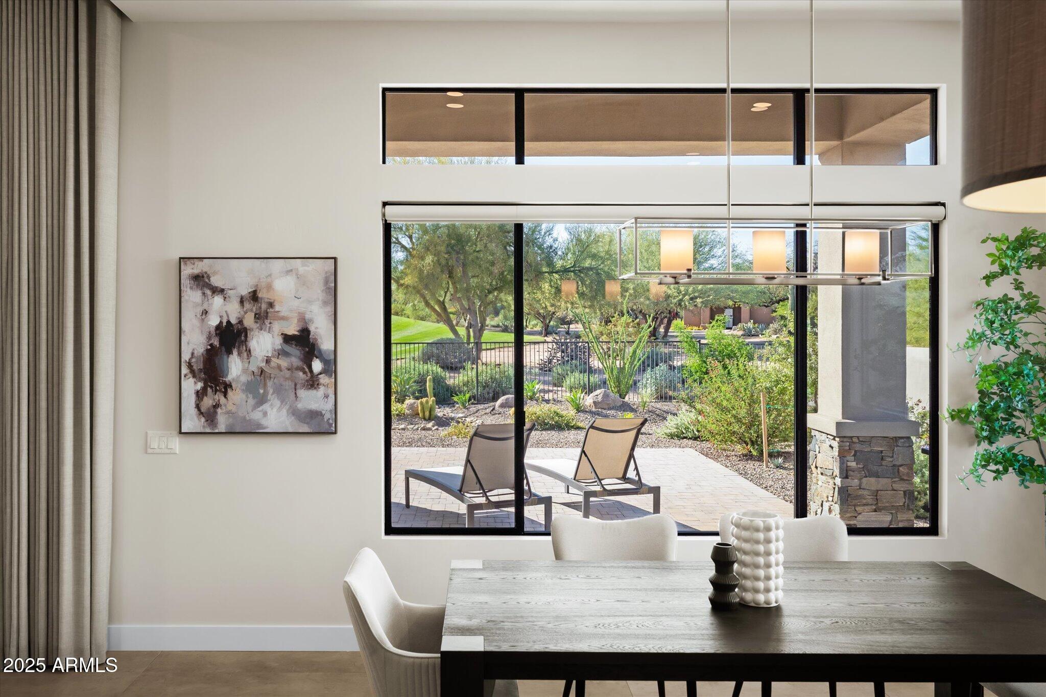 19108 East Tonto Verde Drive Rio Verde, AZ 85263 - Photo 15 of 46 a view of a dining room with furniture window and outside view