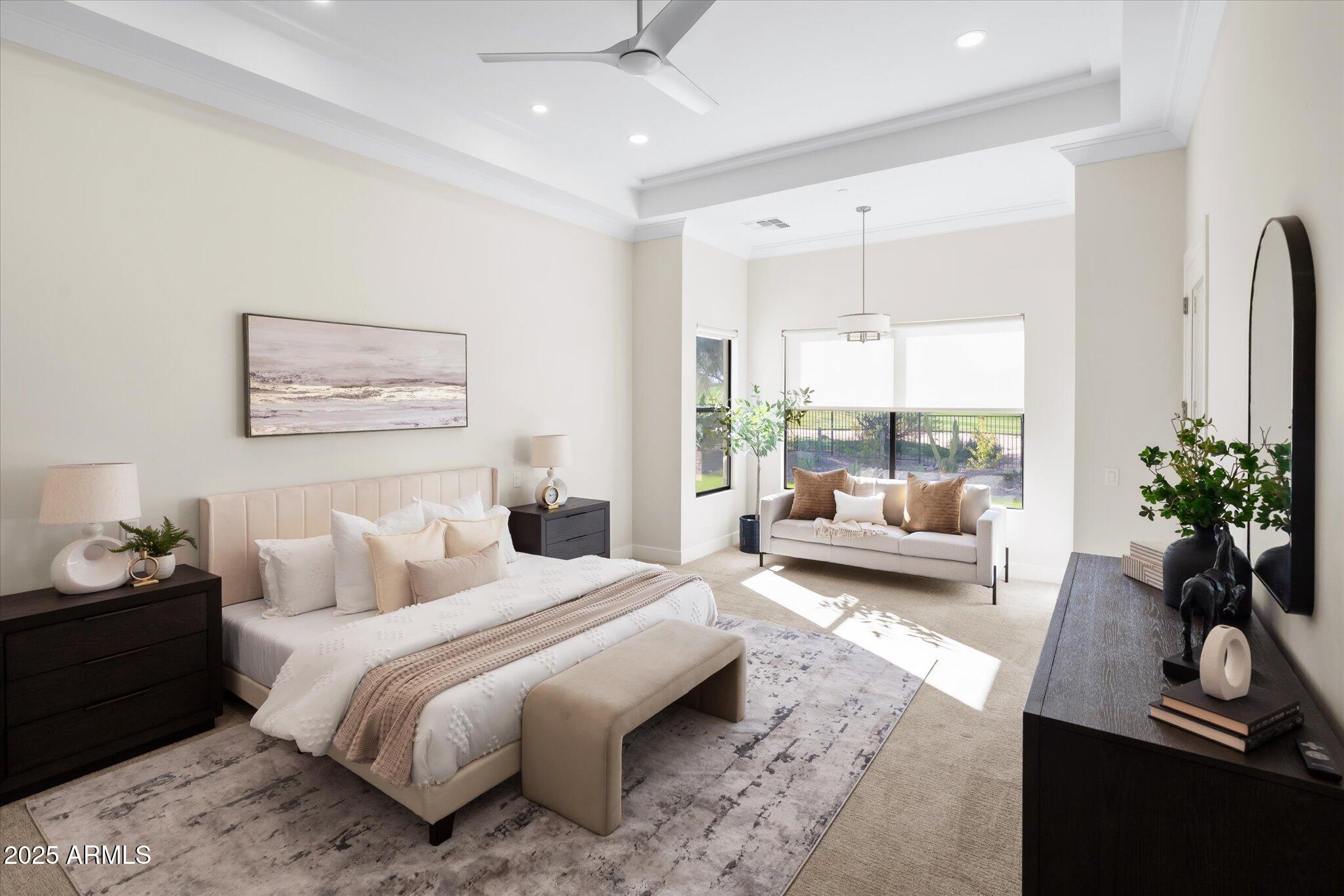 19108 East Tonto Verde Drive Rio Verde, AZ 85263 - Photo 17 of 46 a bedroom with a large bed and a couch