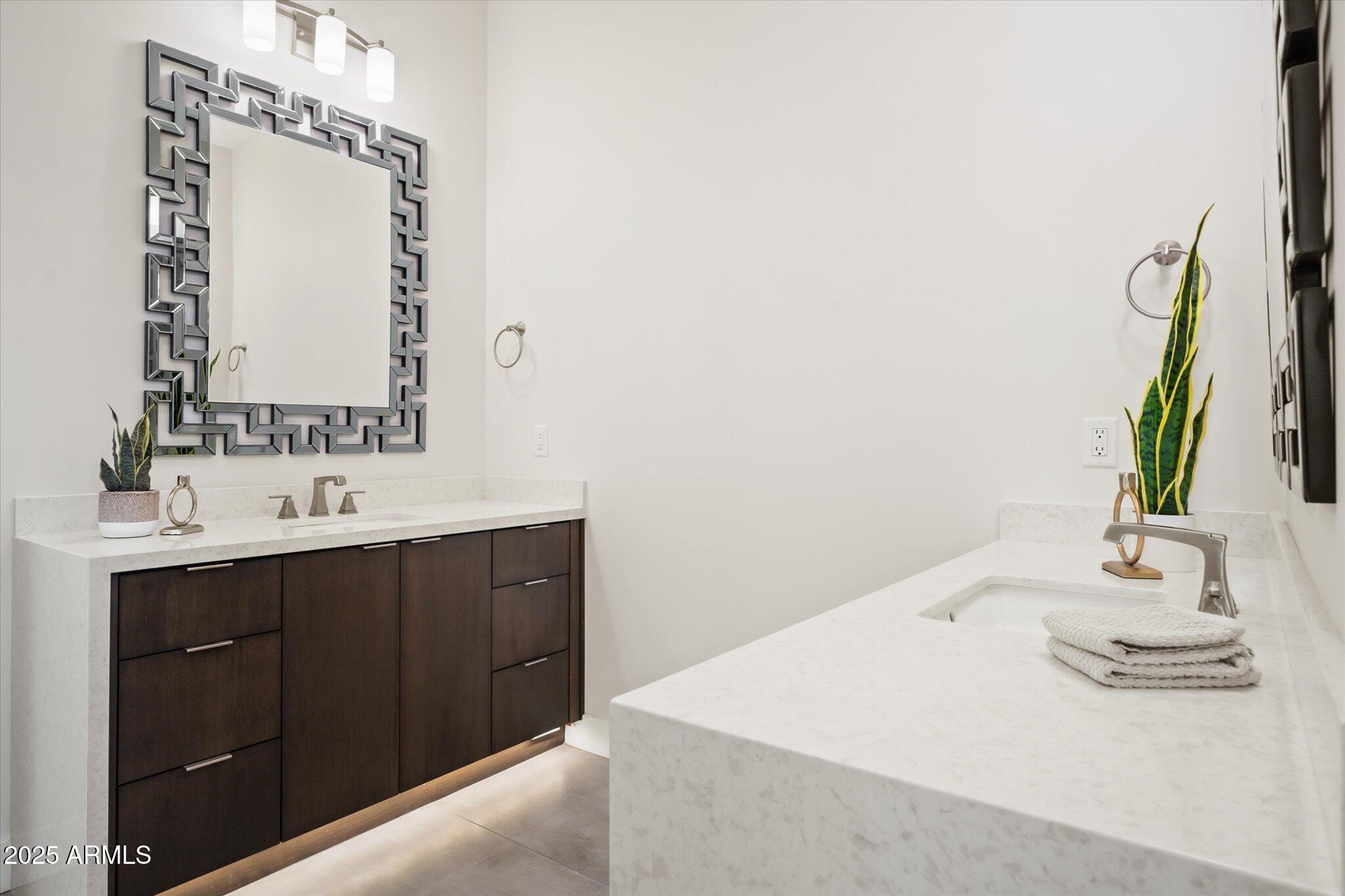 19108 East Tonto Verde Drive Rio Verde, AZ 85263 - Photo 23 of 46 a bathroom with a sink vanity and a mirror