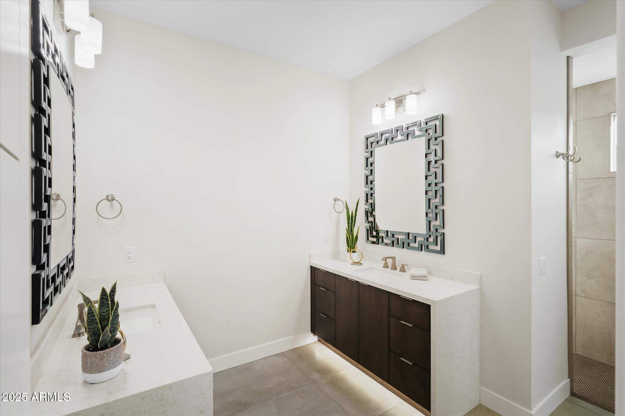 19108 East Tonto Verde Drive Rio Verde, AZ 85263 - Photo 24 of 46 a bathroom with a sink a mirror and a shower