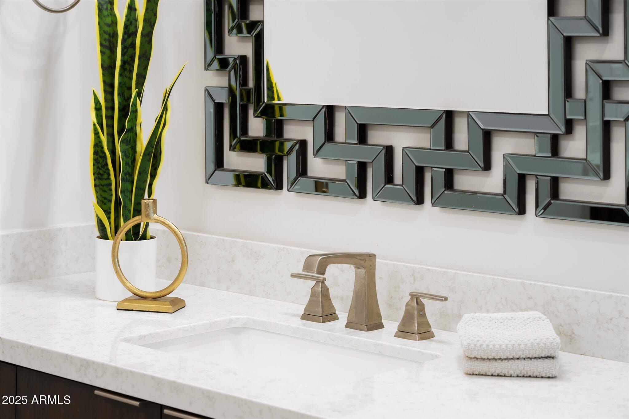19108 East Tonto Verde Drive Rio Verde, AZ 85263 - Photo 25 of 46 a bathroom with a sink a mirror and a potted plant
