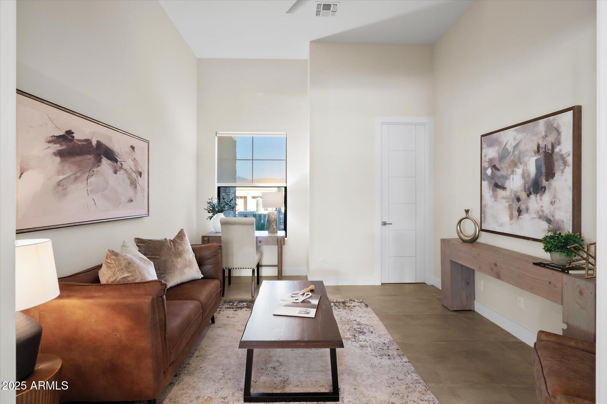 19108 East Tonto Verde Drive Rio Verde, AZ 85263 - Photo 30 of 46 a living room with furniture and a painting on the wall