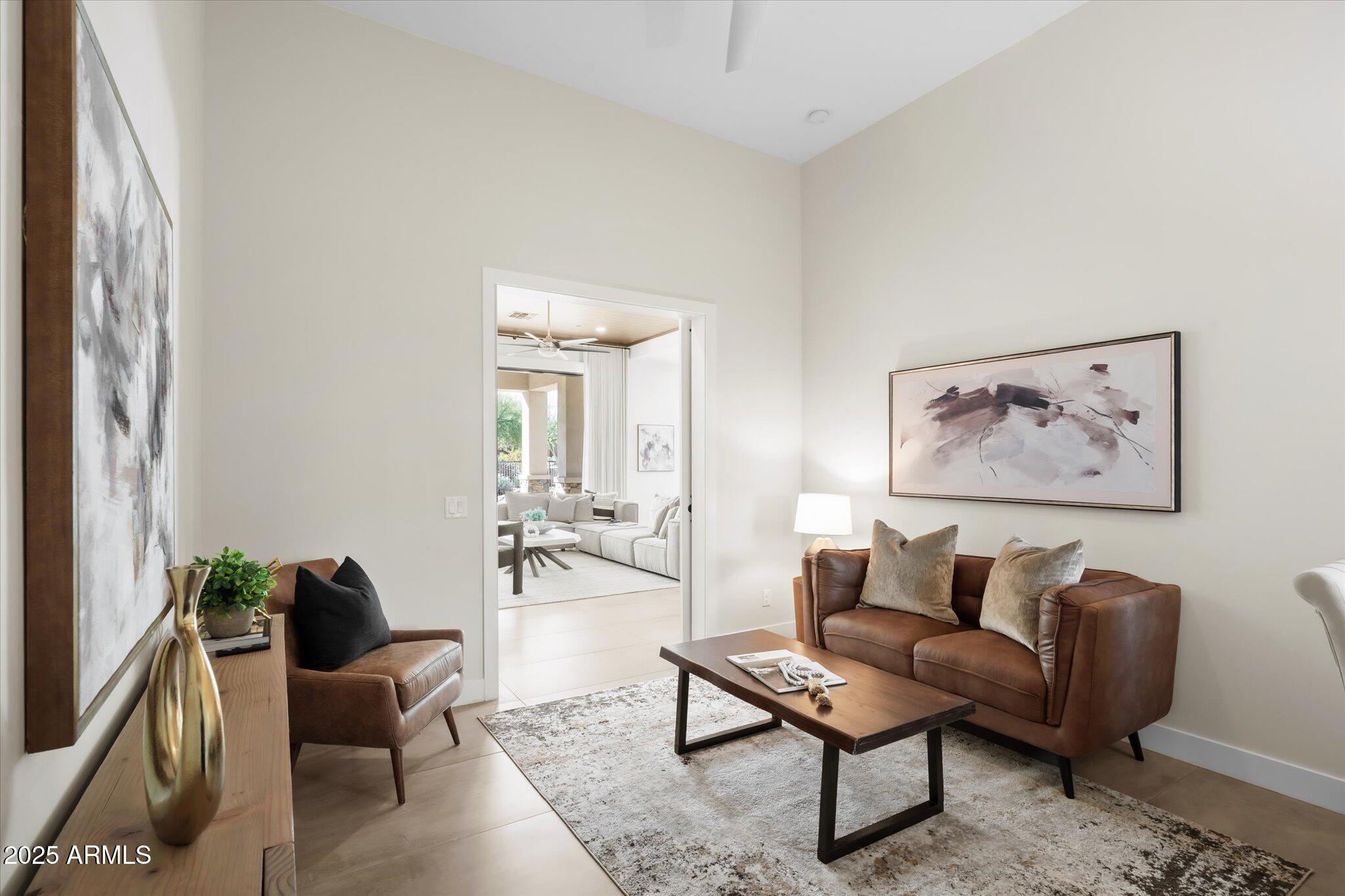 19108 East Tonto Verde Drive Rio Verde, AZ 85263 - Photo 31 of 46 a living room with furniture and a potted plant