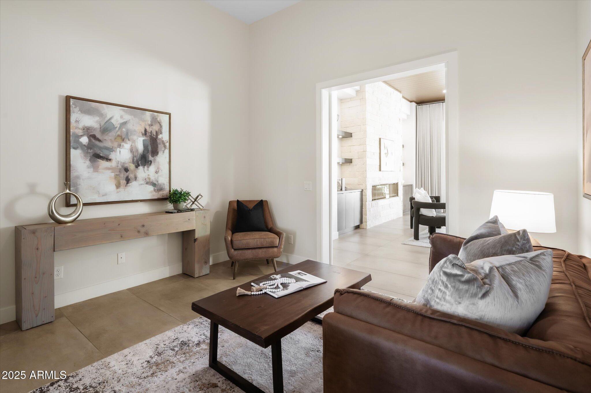 19108 East Tonto Verde Drive Rio Verde, AZ 85263 - Photo 32 of 46 a living room with furniture a rug and a lamp