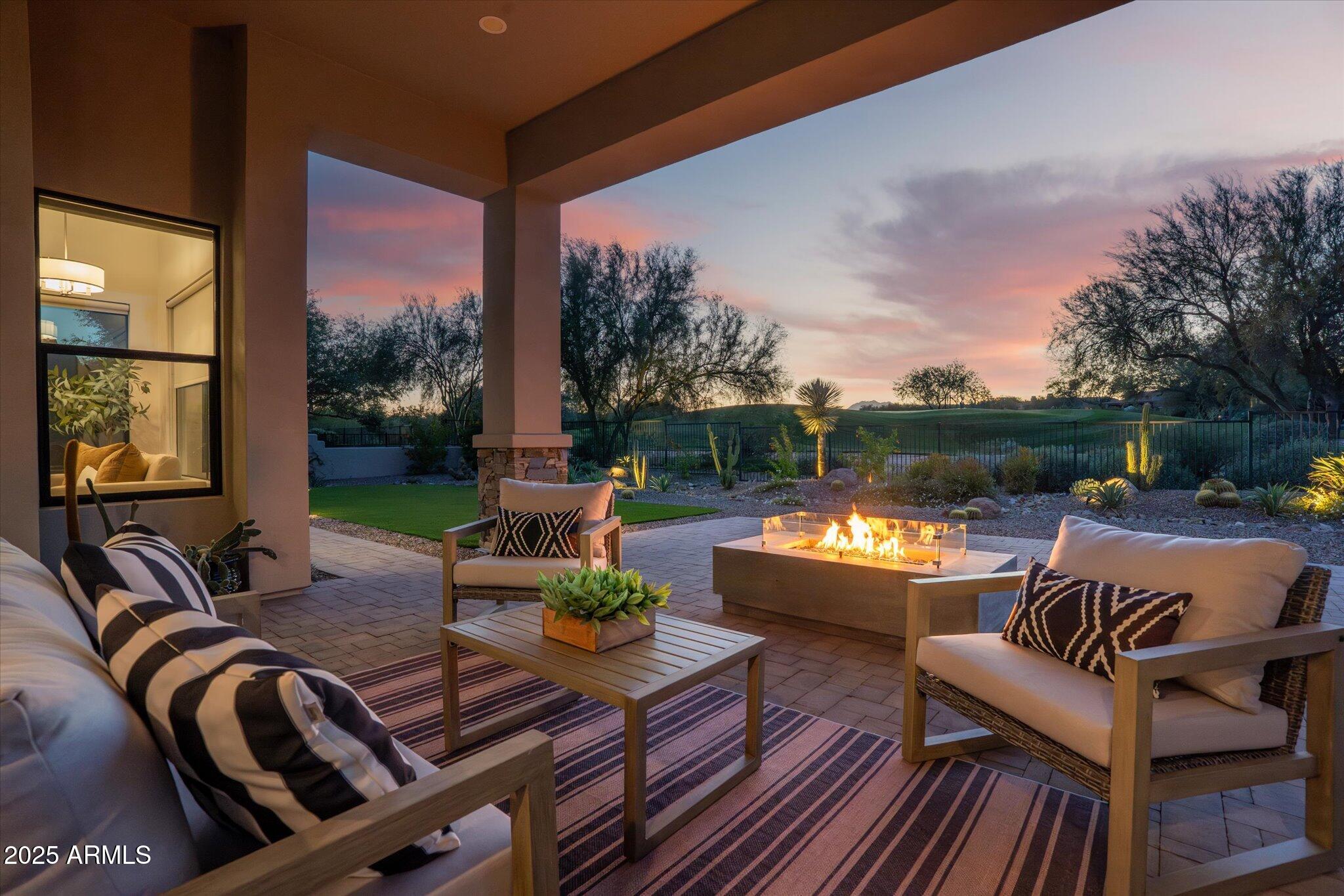 19108 East Tonto Verde Drive Rio Verde, AZ 85263 - Photo 35 of 46 a view of a patio with couches chairs and a potted plant