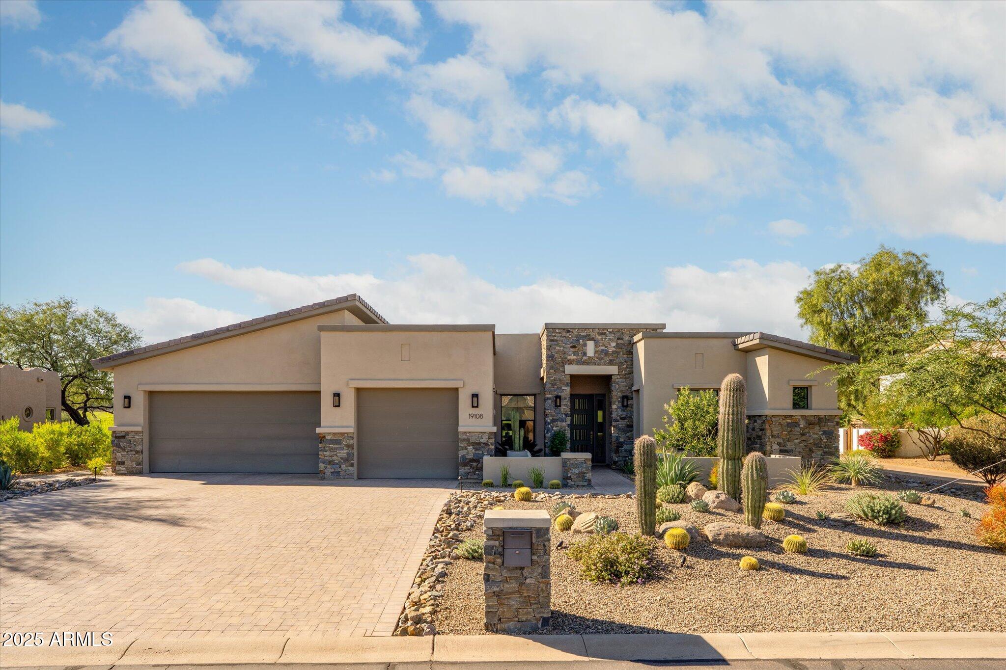 19108 East Tonto Verde Drive Rio Verde, AZ 85263 - Photo 45 of 46 a front view of a house with garden