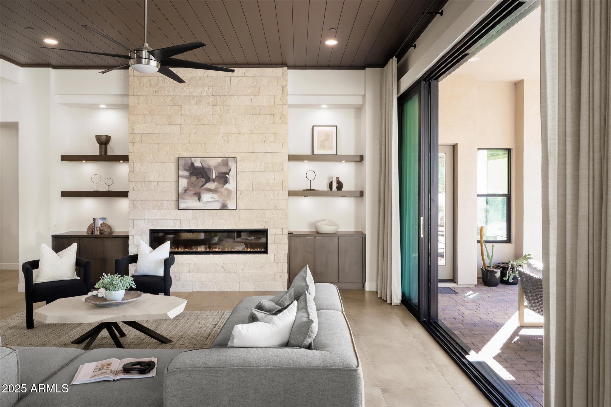 19108 East Tonto Verde Drive Rio Verde, AZ 85263 - Photo 4 of 46 a living room with furniture and a large window
