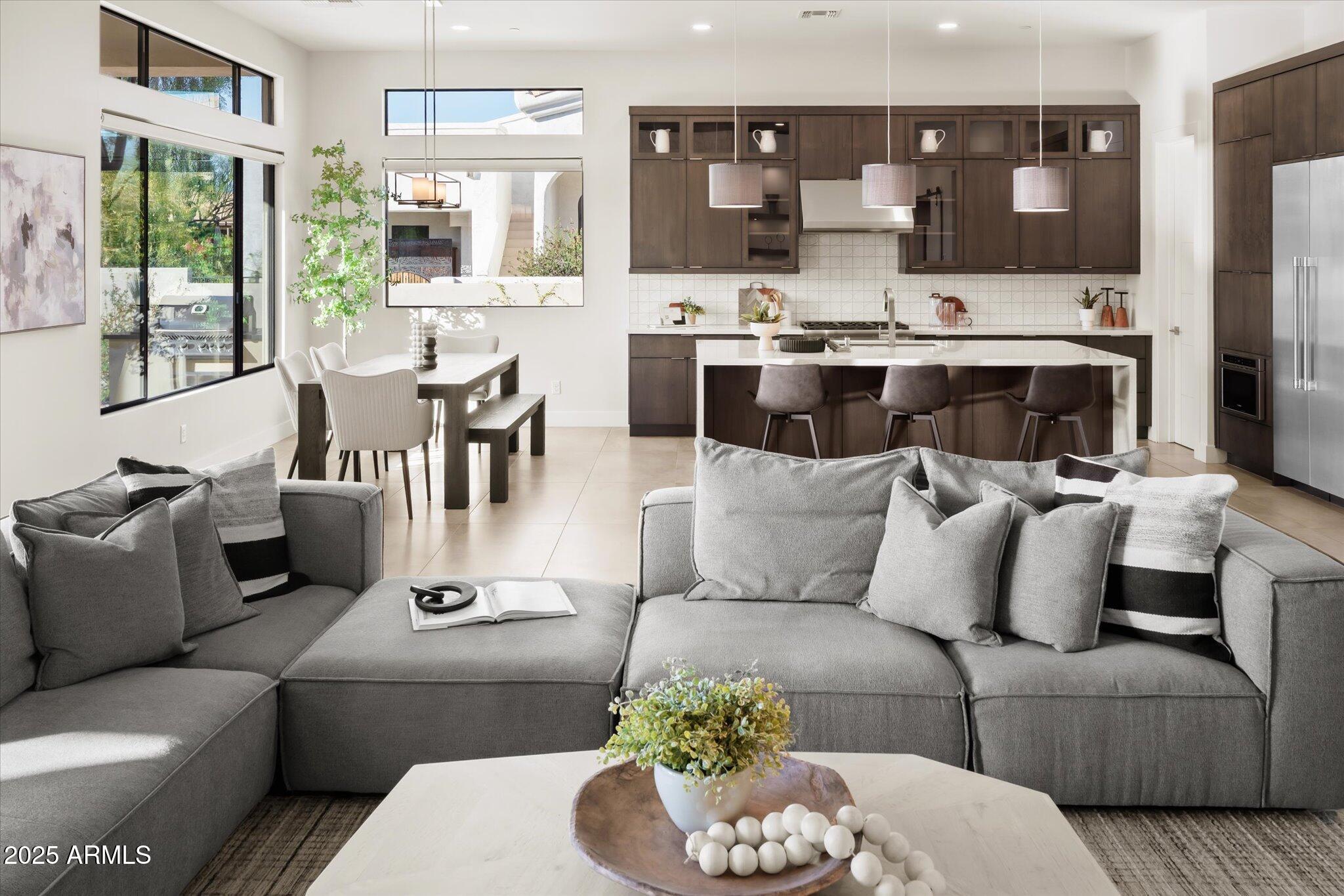 19108 East Tonto Verde Drive Rio Verde, AZ 85263 - Photo 5 of 46 a living room with furniture kitchen view and large windows