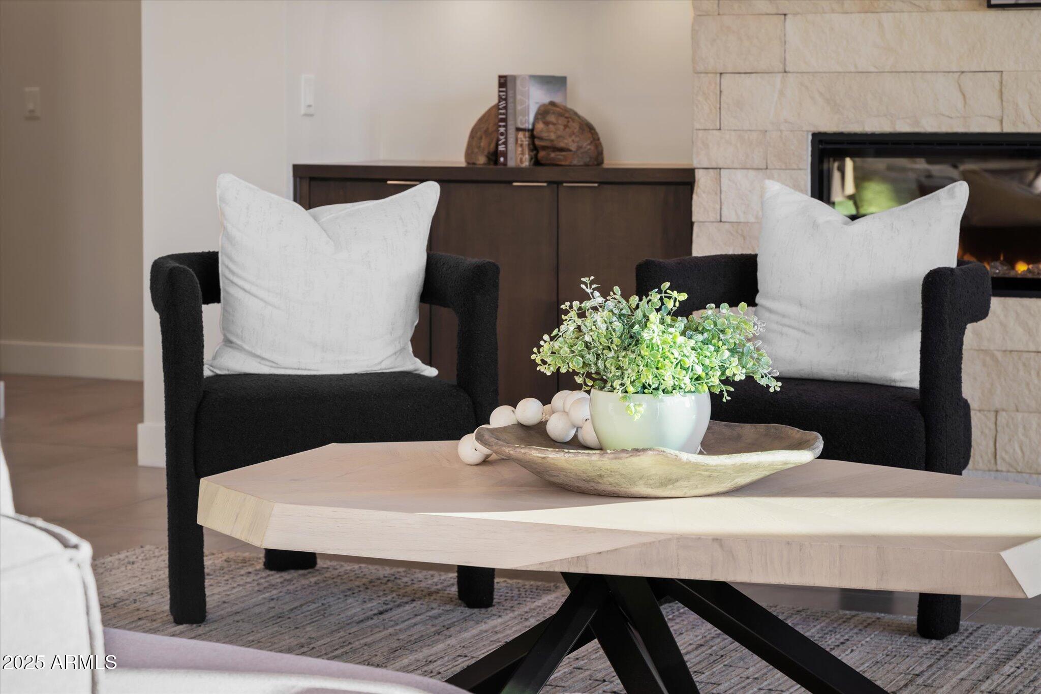 19108 East Tonto Verde Drive Rio Verde, AZ 85263 - Photo 6 of 46 a table with a vase and flowers on it