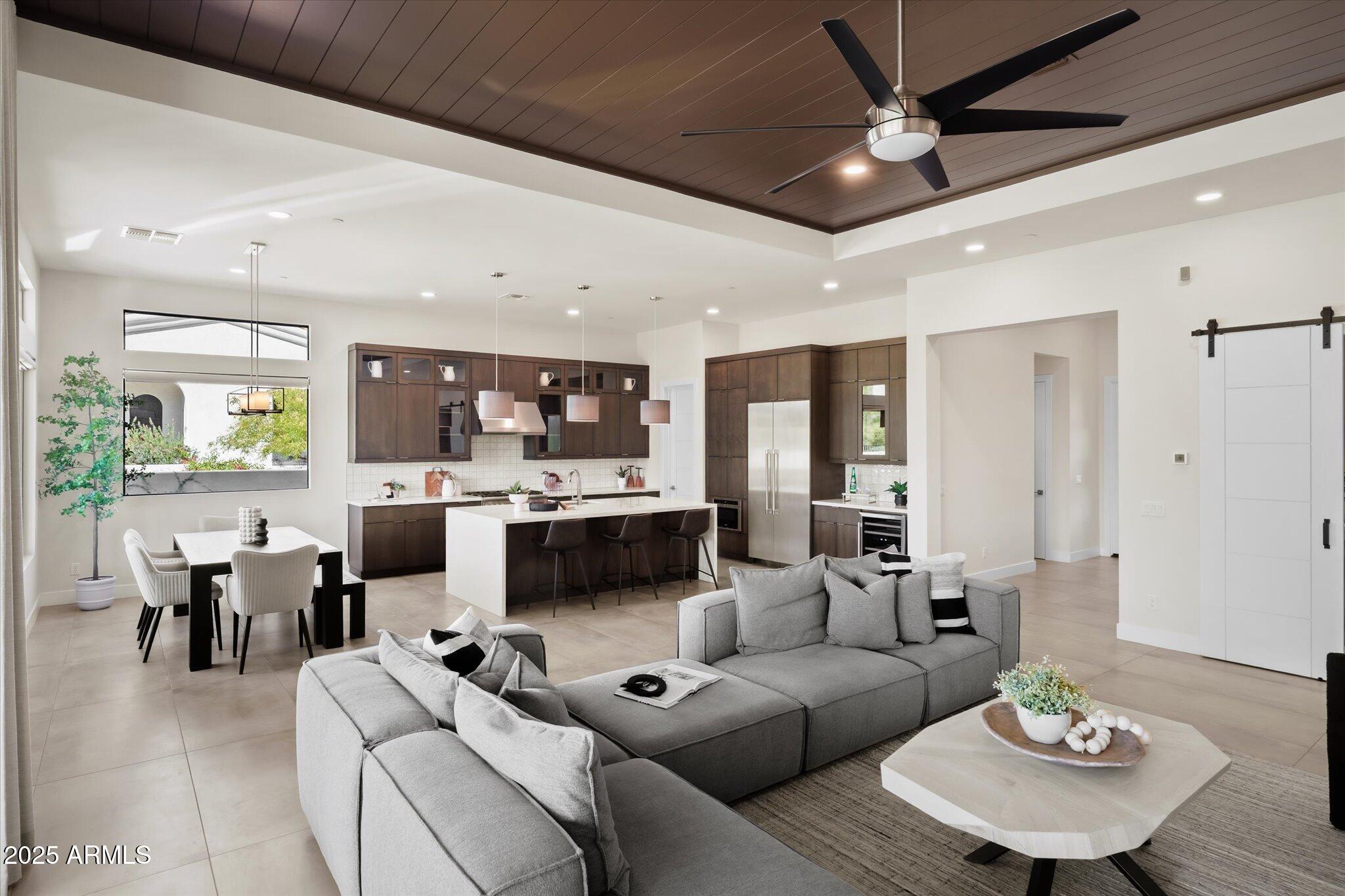 19108 East Tonto Verde Drive Rio Verde, AZ 85263 - Photo 7 of 46 a living room with furniture kitchen view and a chandelier