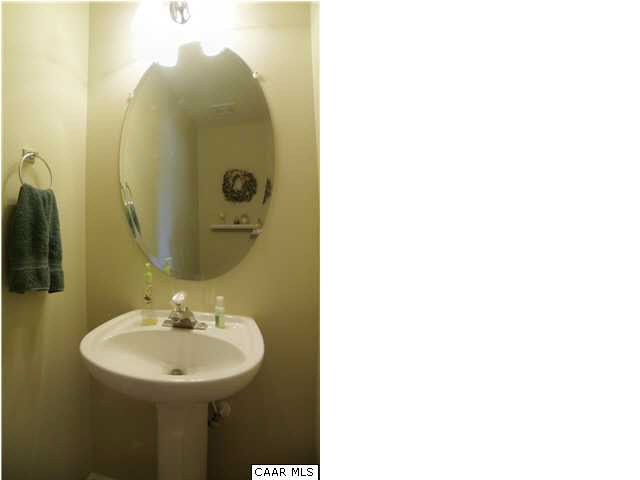 6899 Spring Hill Road Ruckersville, VA 22968 - Photo 23 of 32 a bathroom with a sink and mirror