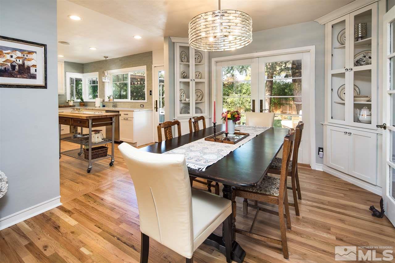 1775 Allen Street Reno, NV 89509 - Photo 9 of 25 a view of a dining room with furniture wooden floor and chandelier