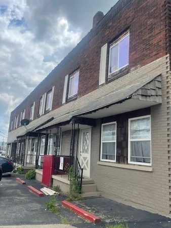 a front view of houses with an outdoor space