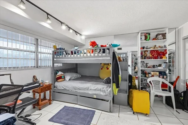 a bedroom with furniture and a bed