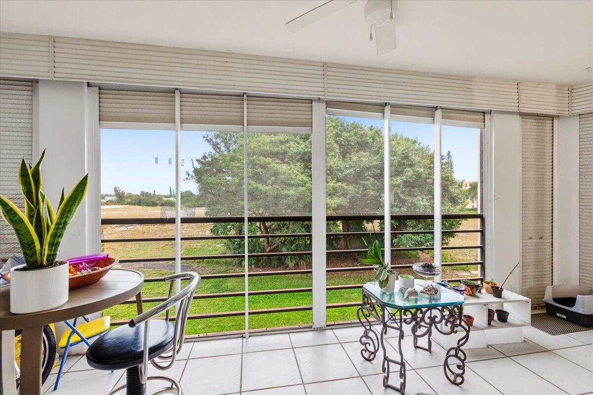 5340 Northwest 2nd Avenue, Unit 323 Boca Raton, FL 33487 - Photo 18 of 21 a view of a dining room with furniture window and outside view