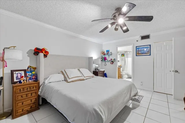 a bedroom with a bed and a cabinets