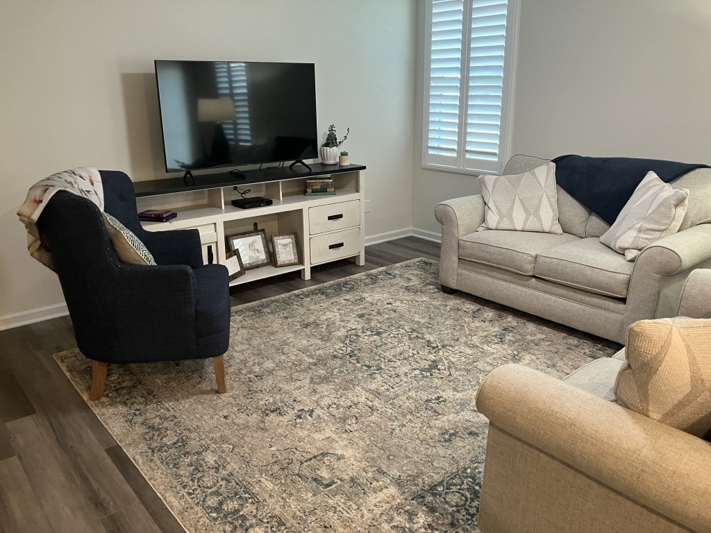 2315 Burnwick Grove Spring Hill, TN 37174 - Photo 3 of 13 a living room with furniture and a flat screen tv