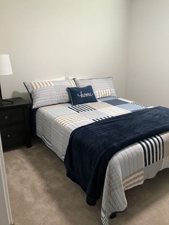 2315 Burnwick Grove Spring Hill, TN 37174 - Photo 10 of 13 a bedroom with a bed and lamp