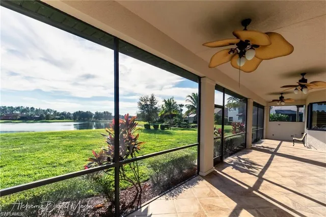 a view of a balcony with floor to ceiling windows with wooden floor