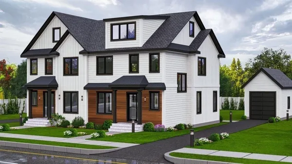 a front view of a house with a yard