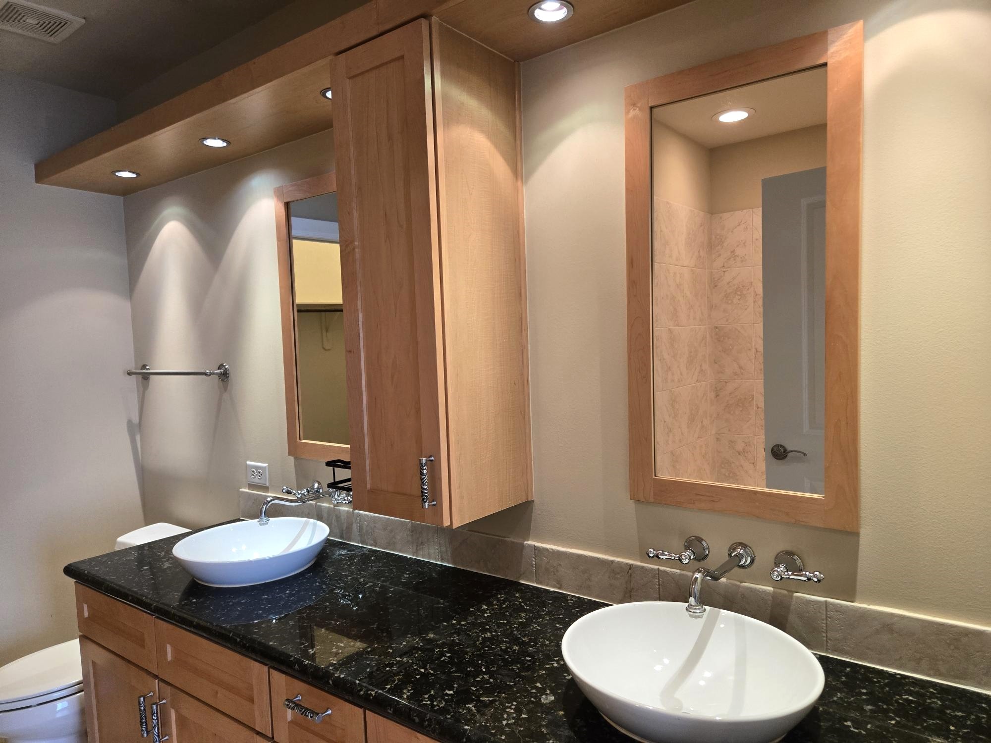 1900 Genesee Street, Unit 207 Houston, TX 77006 - Photo 22 of 50 Dreamy main bath! Long granite vanity. Great lighting! Dual vessel sinks and trendy mirrors.