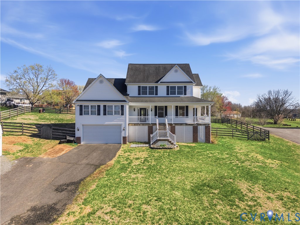 5815 Springfield Farm Lane Mineral, VA 23117 - Photo 1 of 41 View of front of home featuring a porch, a garage,
