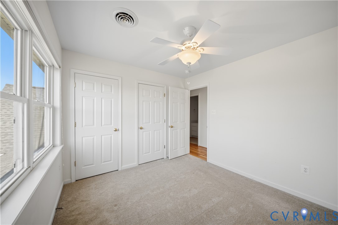 5815 Springfield Farm Lane Mineral, VA 23117 - Photo 18 of 41 Unfurnished bedroom featuring two closets, light c
