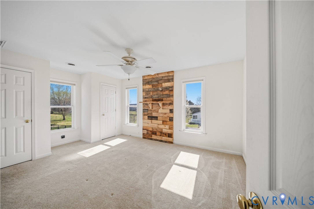 5815 Springfield Farm Lane Mineral, VA 23117 - Photo 20 of 41 Unfurnished bedroom featuring multiple closets, li