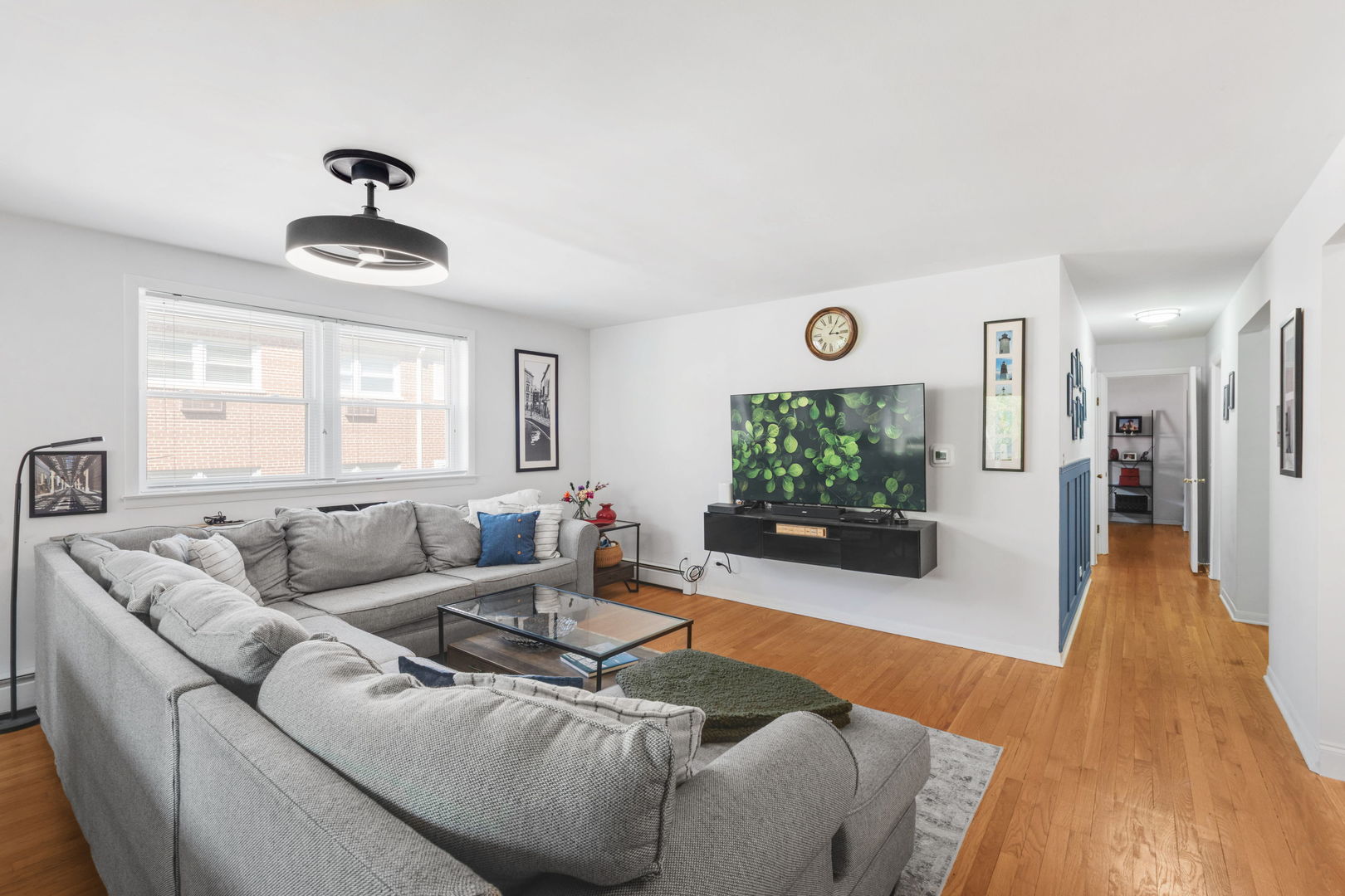 2141 Ridge Avenue, Unit 2B Evanston, IL 60201 - Photo 6 of 13 a living room with furniture and a flat screen tv