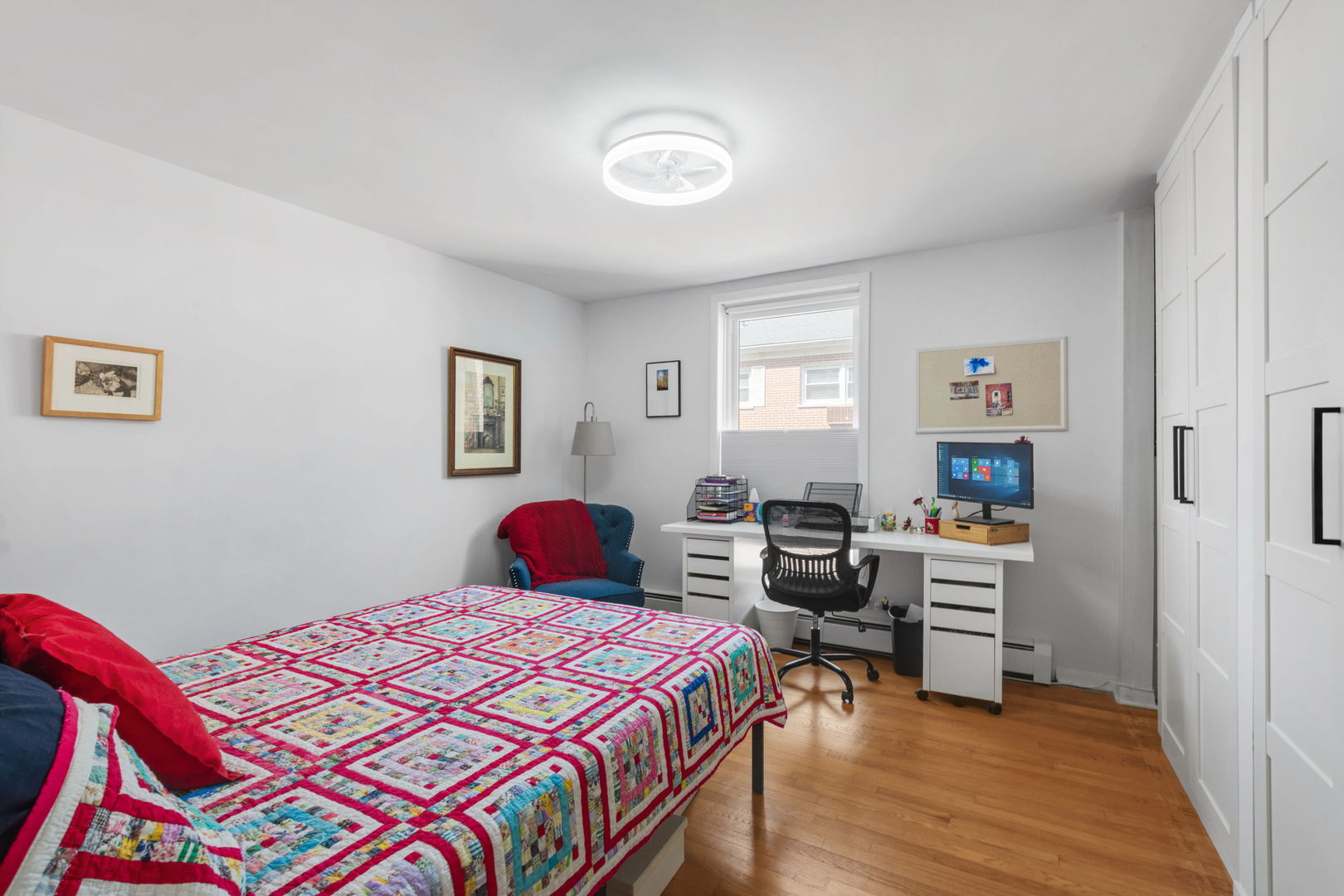 2141 Ridge Avenue, Unit 2B Evanston, IL 60201 - Photo 10 of 13 a bedroom with a bed and wooden floor