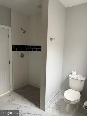 a bathroom with a toilet