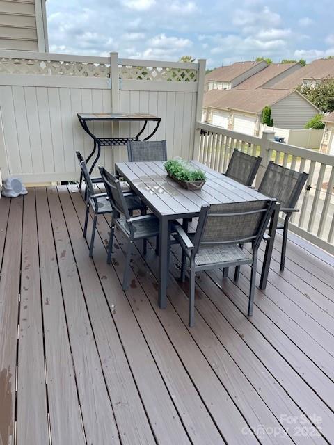 18547 The Commons Boulevard Cornelius, NC 28031 - Photo 12 of 33 a view of a roof deck with table and chairs