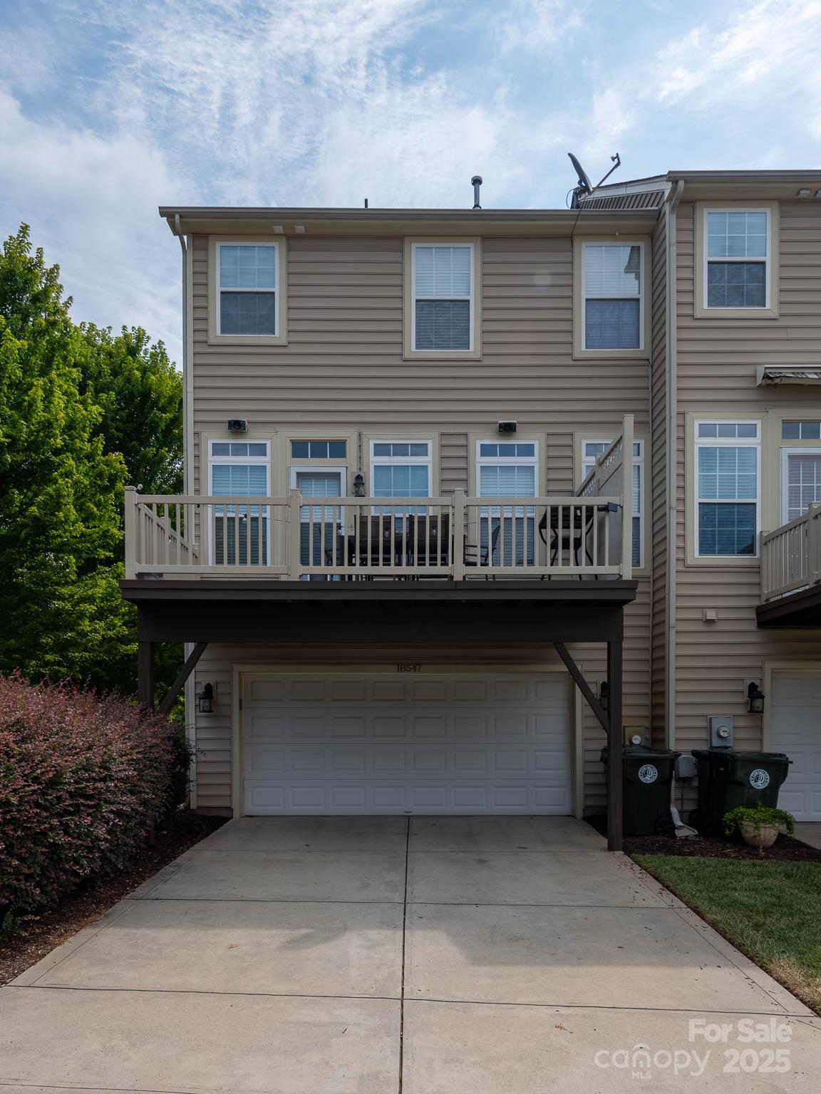 18547 The Commons Boulevard Cornelius, NC 28031 - Photo 27 of 33 a view of a house with a balcony