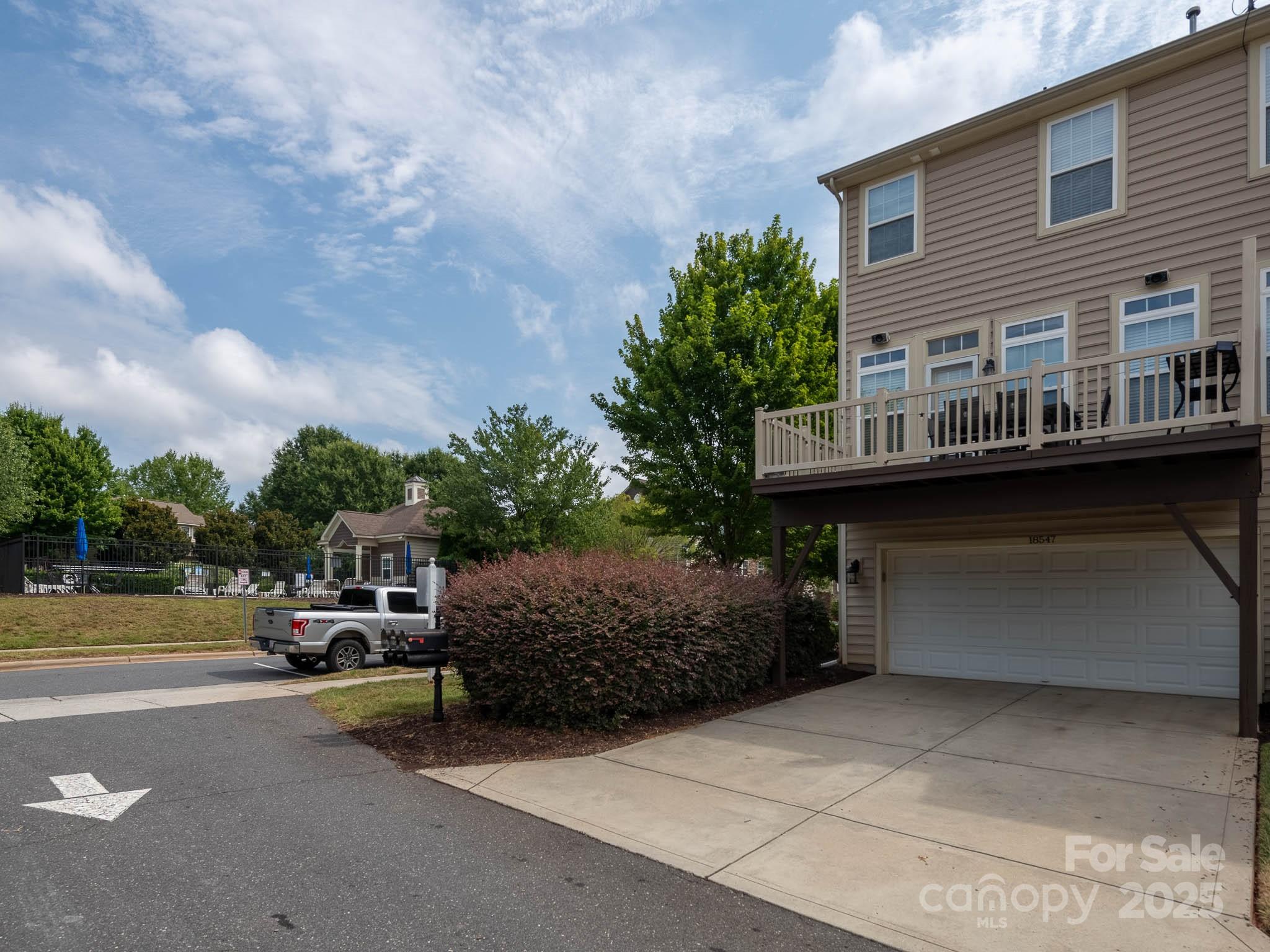 18547 The Commons Boulevard Cornelius, NC 28031 - Photo 28 of 33 a couple of cars parked in front of a house
