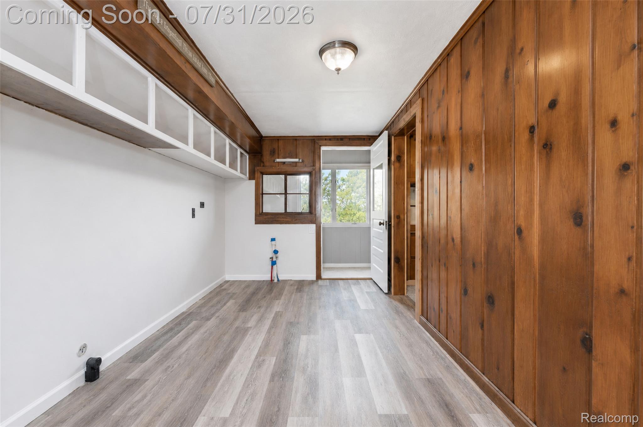 5269 Reno Road Manchester, MI 48158 - Photo 60 of 64 Room featuring partial wood-paneled walls and wood-finish flooring