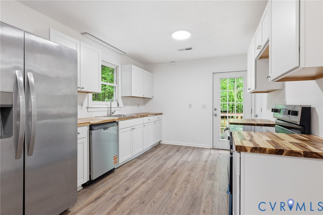 3220 Greenway Road Gladstone, VA 24553 - Photo 10 of 29 a kitchen with a refrigerator stove and a window