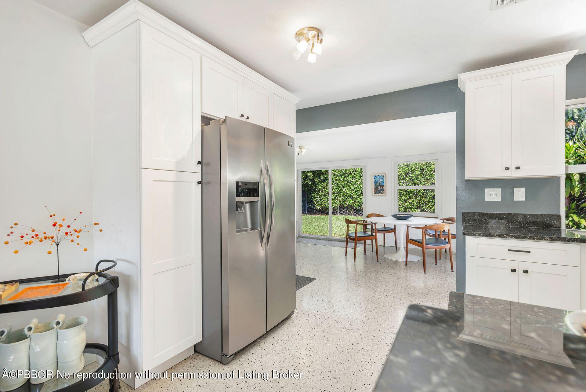 173 Arlington Road West Palm Beach, FL 33405 - Photo 15 of 27 a kitchen with stainless steel appliances granite countertop a refrigerator and a sink