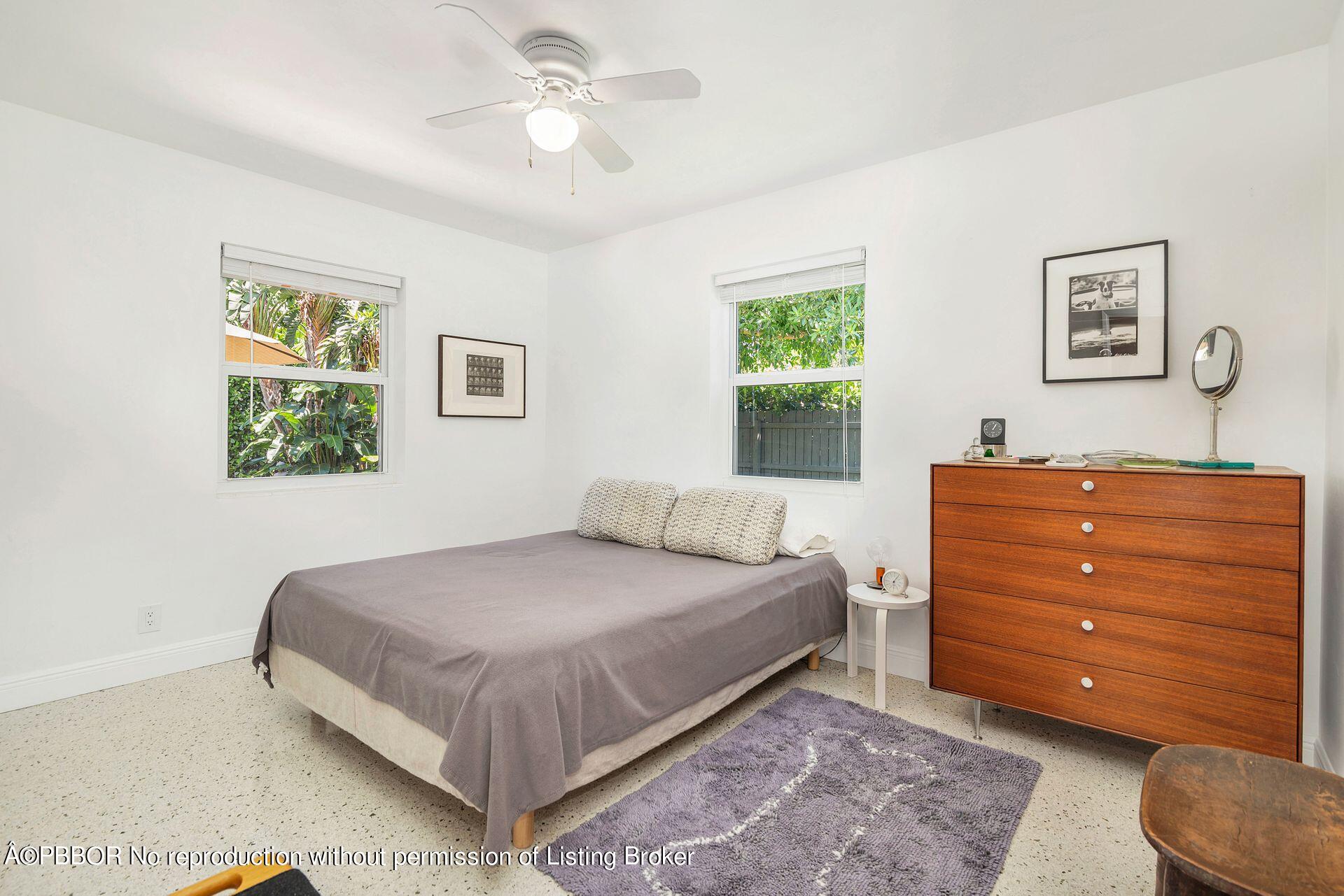 173 Arlington Road West Palm Beach, FL 33405 - Photo 21 of 27 a bedroom with a bed and a dresser