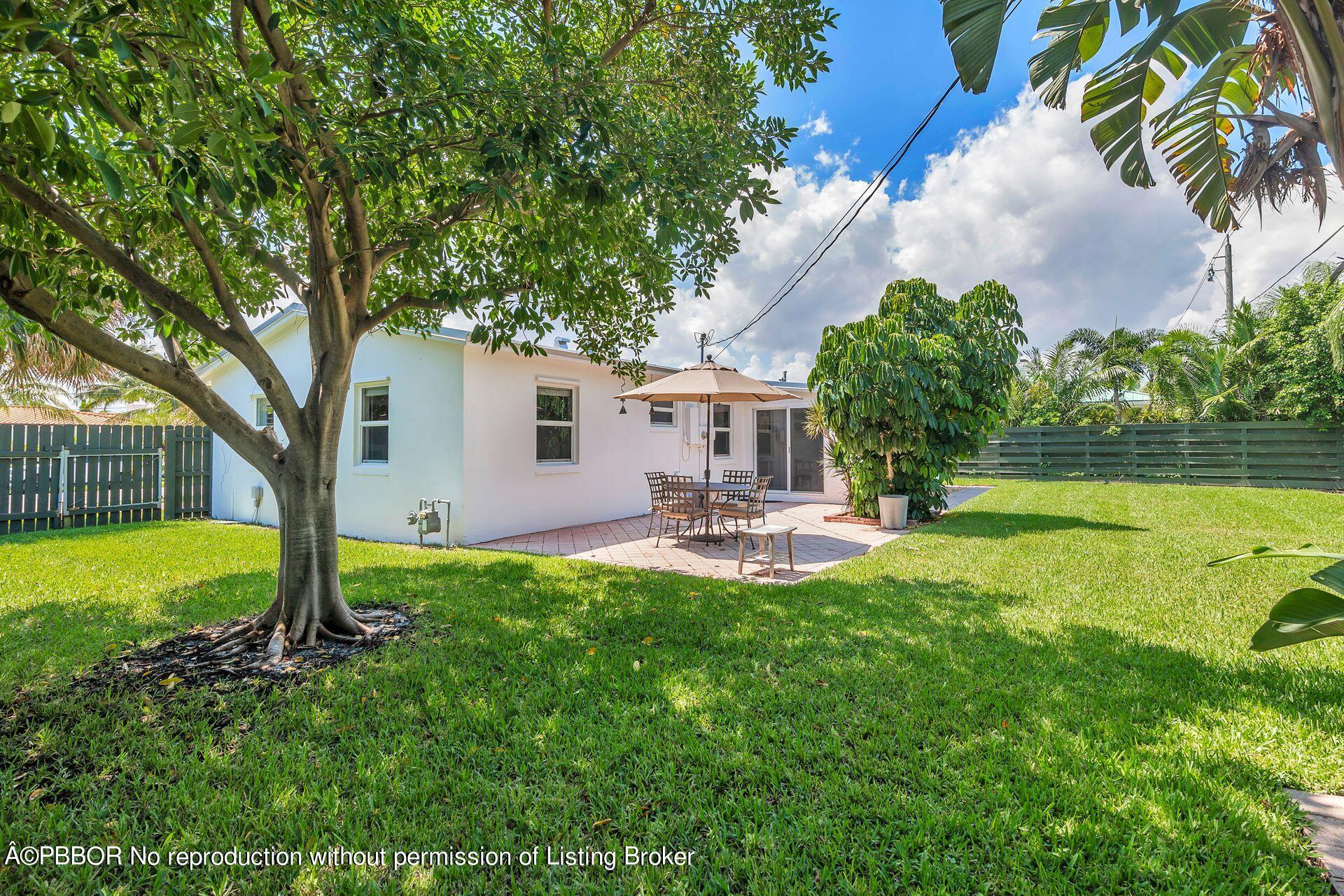 173 Arlington Road West Palm Beach, FL 33405 - Photo 23 of 27 a view of a house with backyard and sitting area