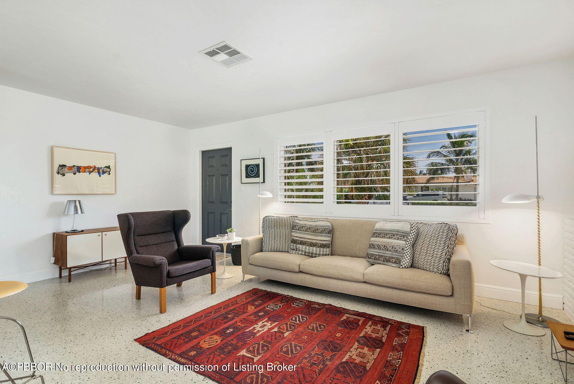 173 Arlington Road West Palm Beach, FL 33405 - Photo 4 of 27 a living room with furniture and a rug