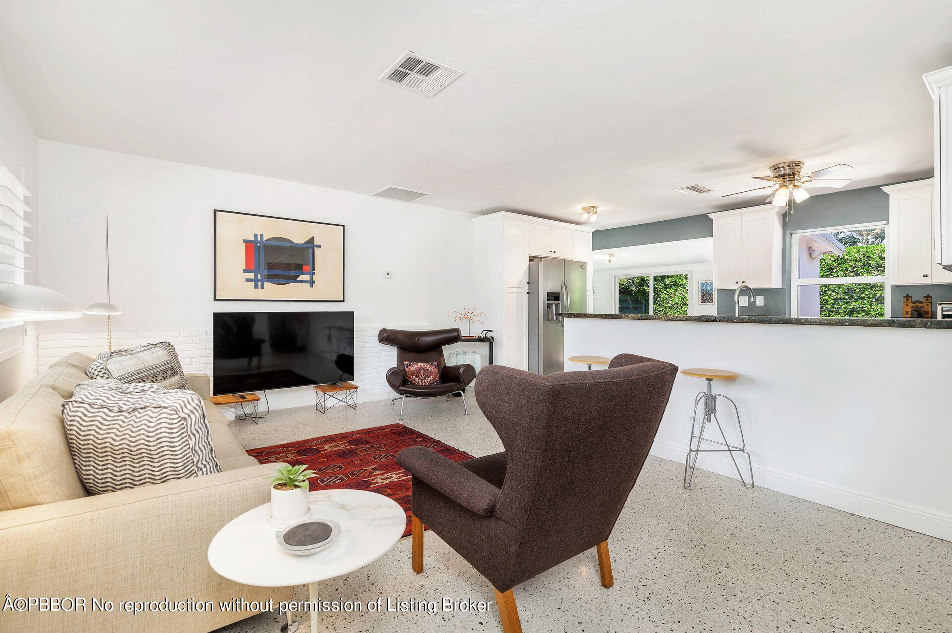 173 Arlington Road West Palm Beach, FL 33405 - Photo 10 of 27 a living room with furniture and a fireplace