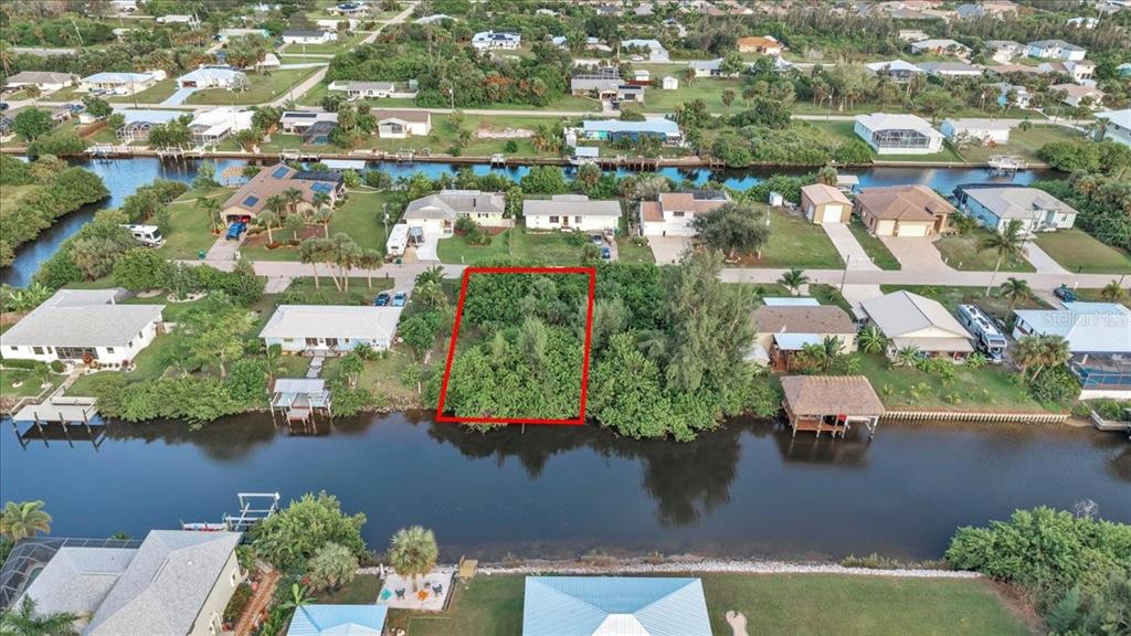 3623 Magnolia Way Punta Gorda, FL 33950 - Photo 3 of 9 an aerial view of a house with a lake view