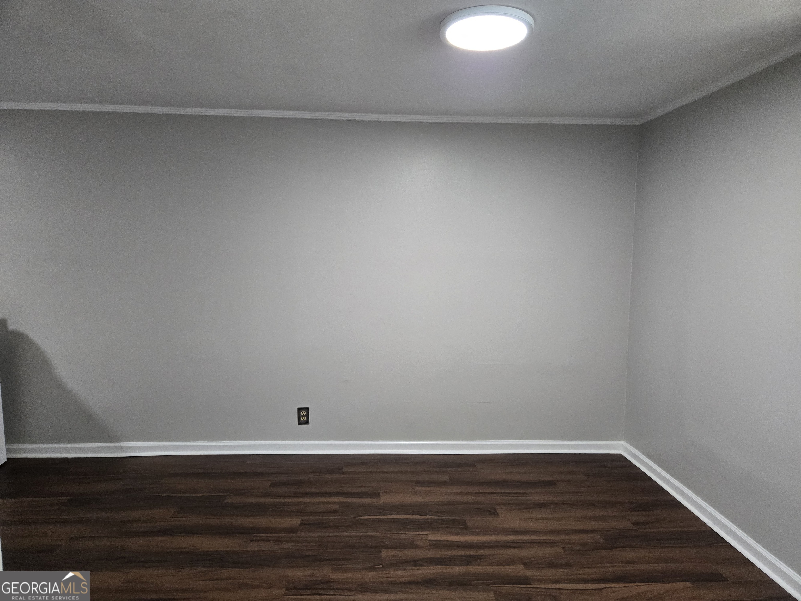 101 King Street Fort Valley, GA 31030 - Photo 12 of 17 a view of an empty room and wooden floor