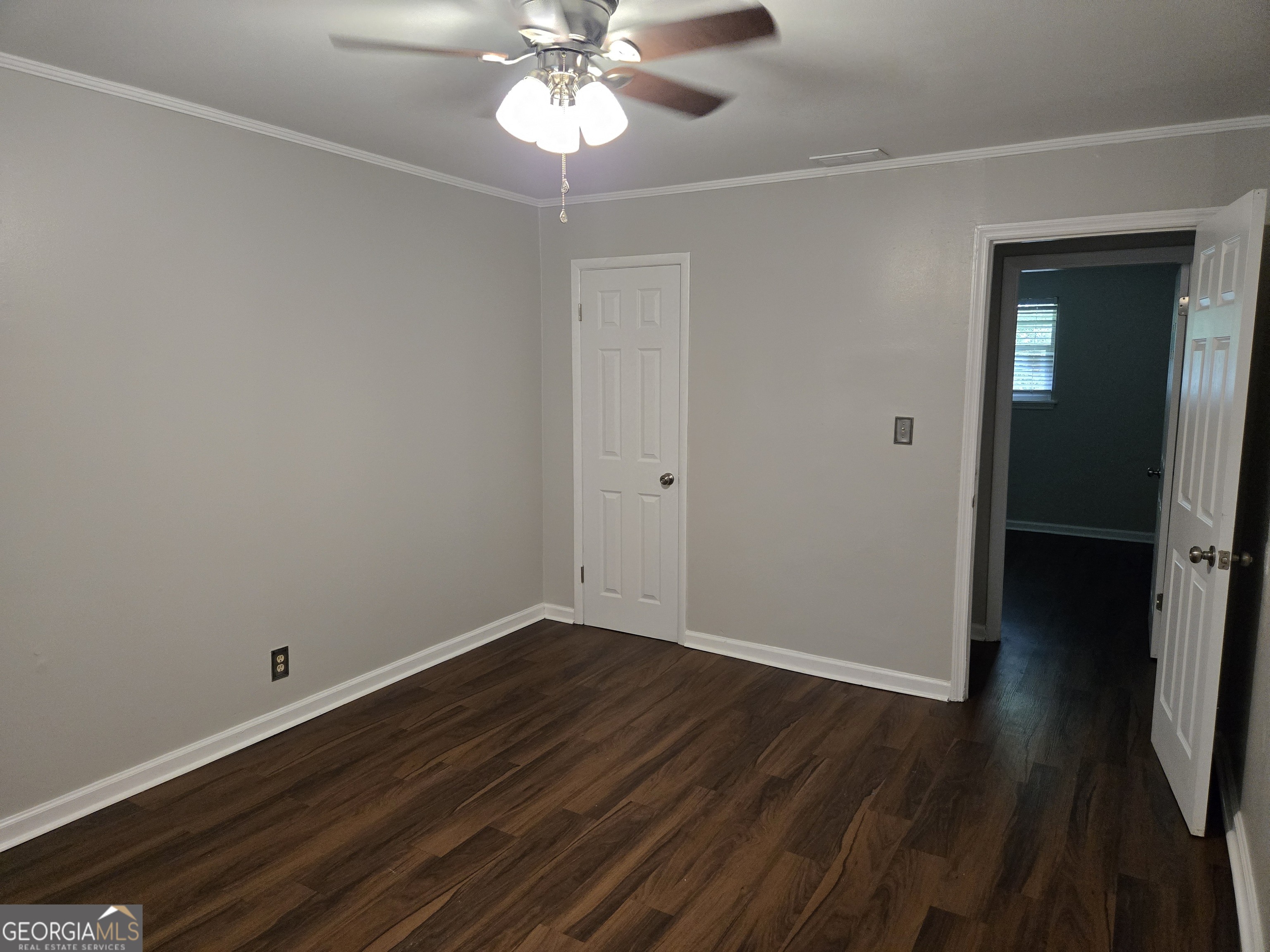 101 King Street Fort Valley, GA 31030 - Photo 13 of 17 a view of an empty room with wooden floor