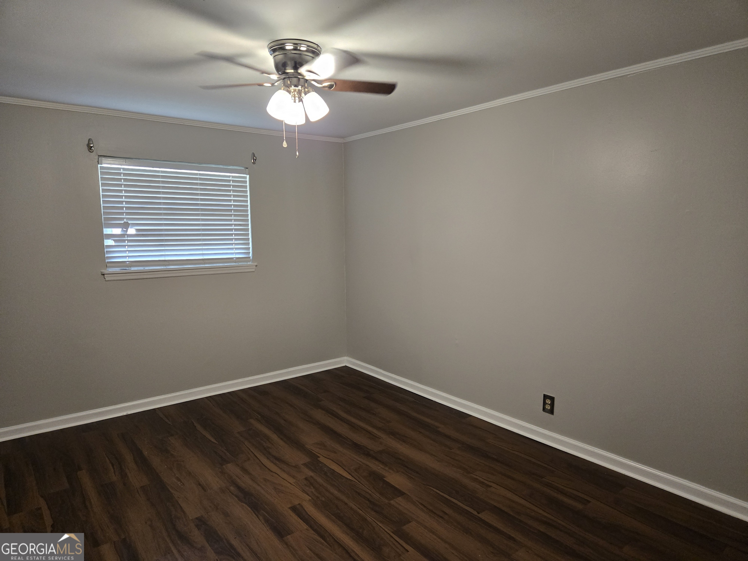 101 King Street Fort Valley, GA 31030 - Photo 16 of 17 a view of a room with wooden floor and a window